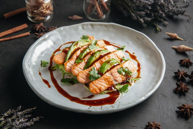 Plate of gourmet salmon and avocado appetizer