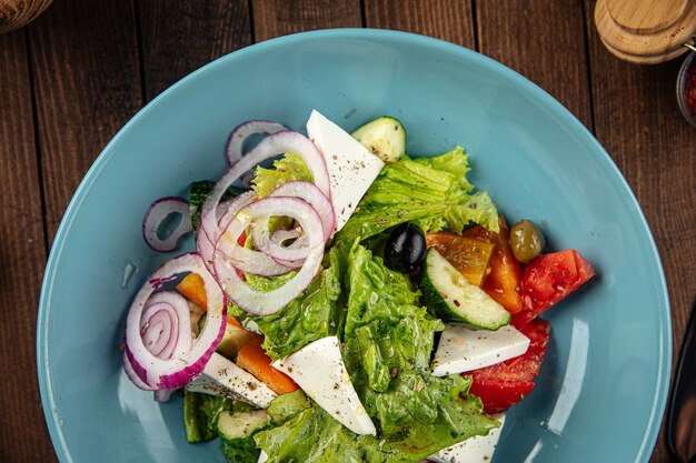 Plate of greek salad with fresh vegetables