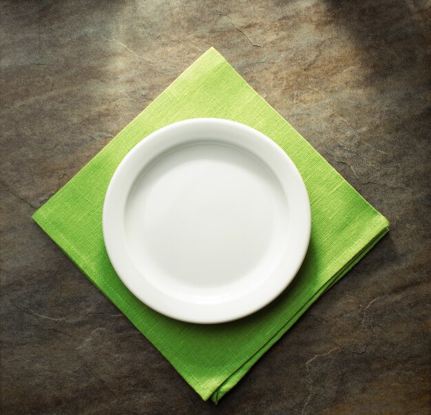 Plate on green napkin cloth