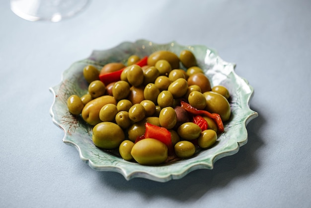 Plate of green olives appetizer