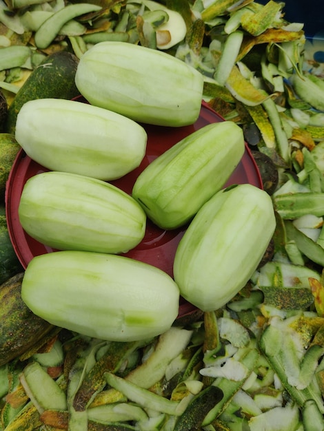 A plate of green vegetables with the word cucumber on it