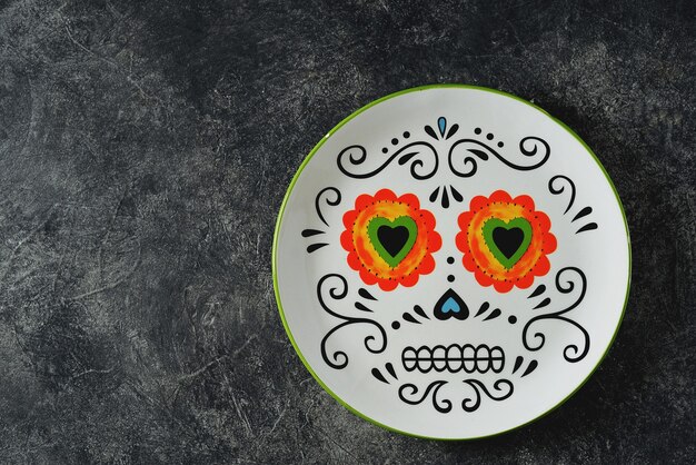 Plate for Halloween party on a dark background