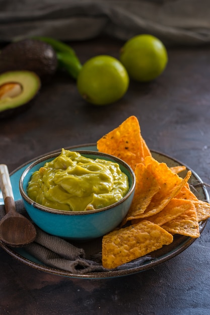 Plate of homemade guacamole with nachos. 