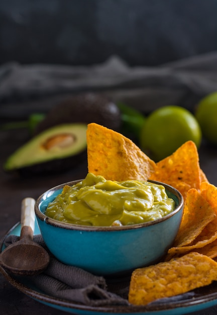 Plate of homemade guacamole with nachos.