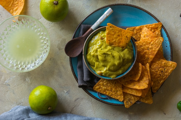 Plate of homemade guacamole with nachos. 