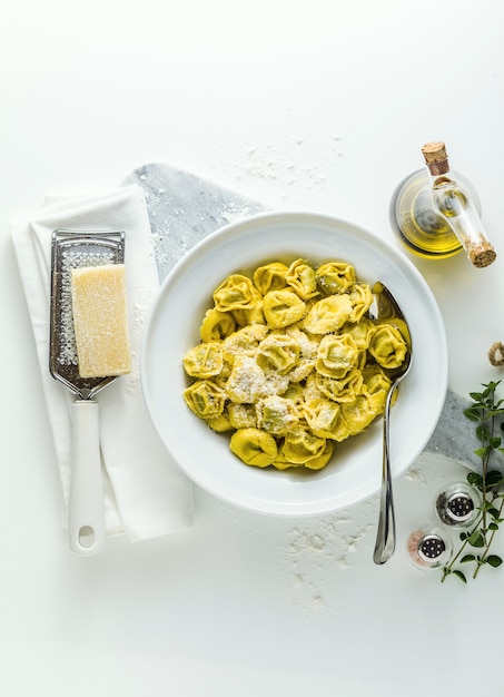 Plate of italian ravioli with plate of italian ravioli with parmesan cheese