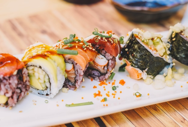 A plate of Japanese food made up of different types of sushi pieces