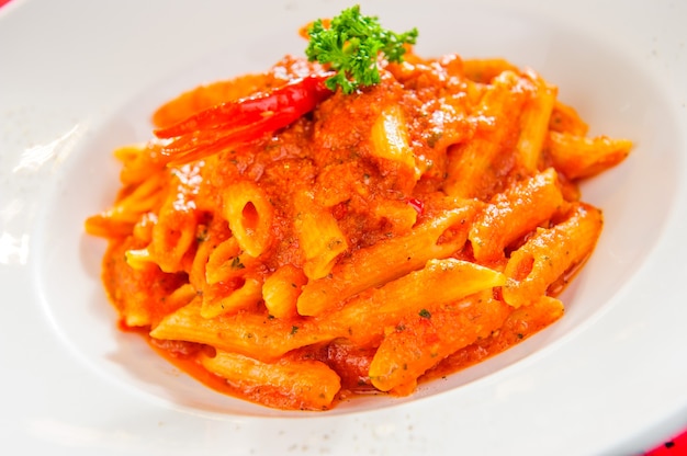 Plate of macaroni dish with tomato sauce