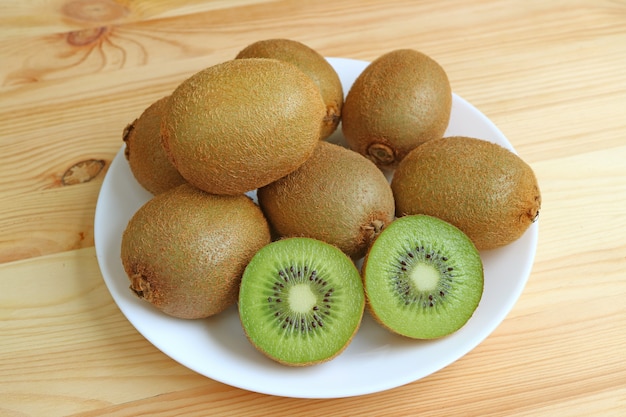 Plate of many fresh ripe kiwi fruits