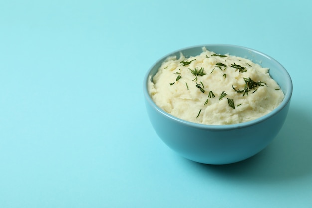 Plate of mashed potatoes on blue