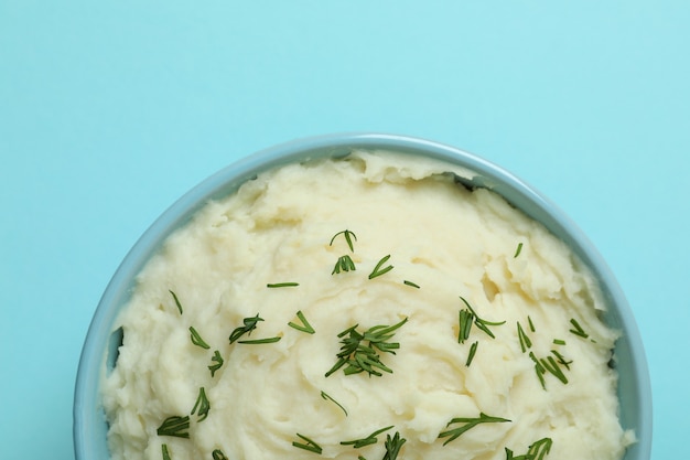 Plate of mashed potatoes on blue