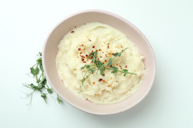 Plate of mashed potatoes on white