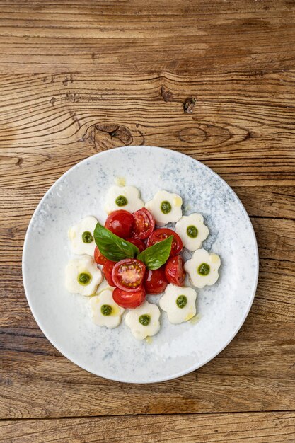 A plate of mozzarella and tomato salad