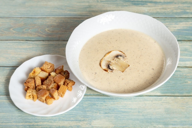Plate of mushroom cream soup with croutons 