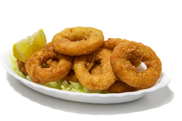 A plate of perfectly fried calamari rings isolated on a white background