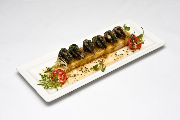 Plate of Provencal snails on bread dipped in shallot butter sauce with garlic and herbs food