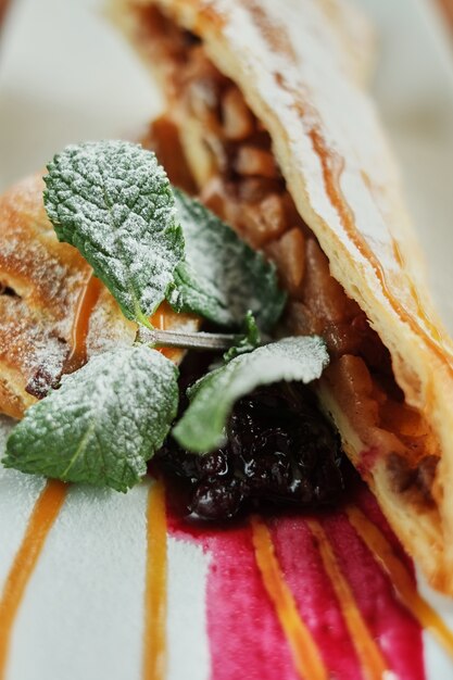 On plate of puff pastry. wooden background close-up