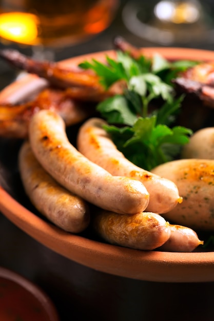 Plate of sausages and glasses 