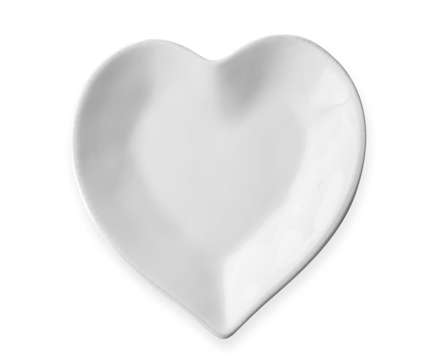 Plate in shape of heart on white background