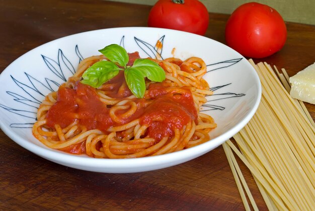 Plate of spaghetti with sauce and basil