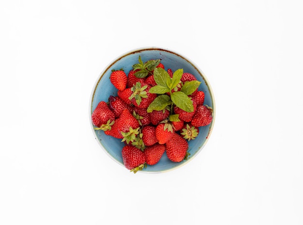 Photo plate of strawberries on white background