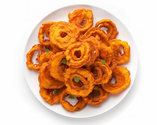 A plate of sweet potato fries with a green leaf on top.