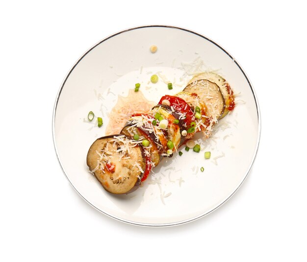 Plate of tasty baked eggplant and tomatoes on white background