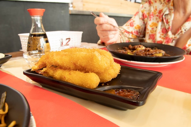 A plate of Tempura Prawns, served in a Japanese restaurant. Japanese food concept.