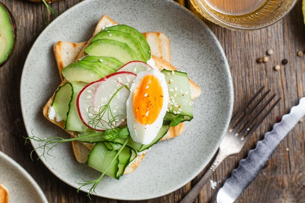 A plate of toast with a fried egg on it