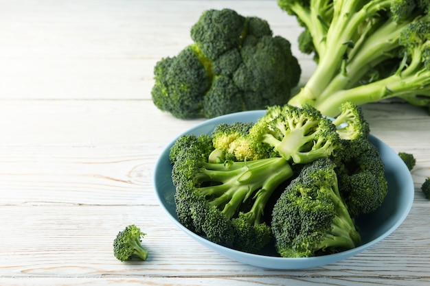 Plate with broccoli on wooden