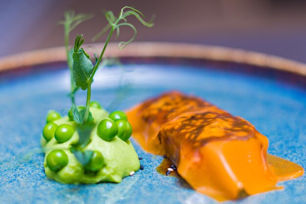 a plate with carrots and green beans and carrots on it