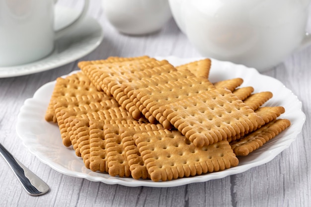 Plate with cornstarch biscuit on the table