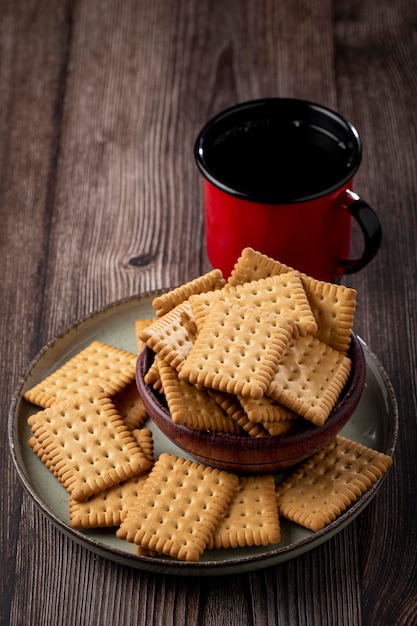 Plate with cornstarch biscuit on the table