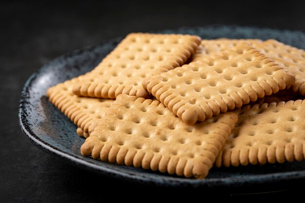 Plate with cornstarch biscuit on the table