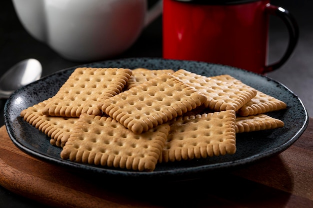 Plate with cornstarch biscuit on the table