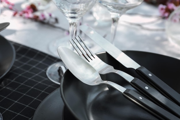 Plate with cutlery on served table closeup