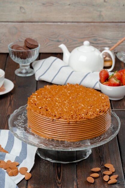 Plate with delicious caramel cake close up