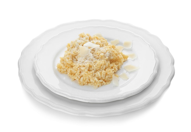 Plate with delicious risotto on white background