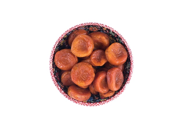 Photo plate with dried apricots isolated on white background