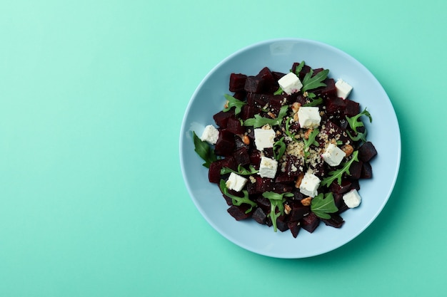 Plate with fresh beet salad on mint