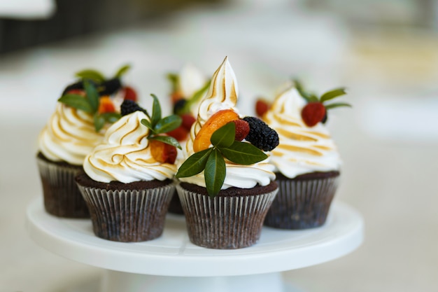 Plate with freshly baked sweet muffins. Sweet pastries, recipes, cooking