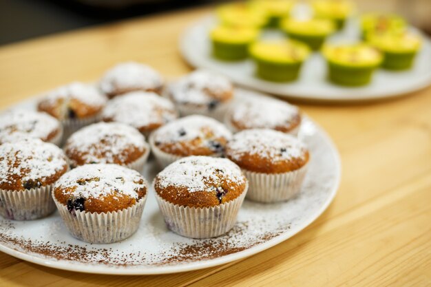 Plate with freshly baked sweet muffins