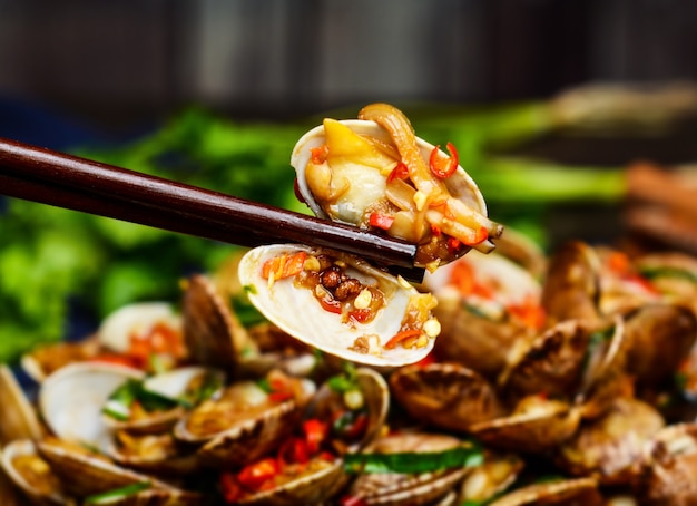 Photo plate with fried clams on table