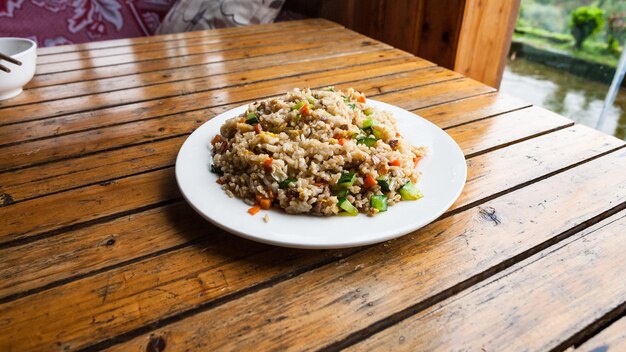 Plate with fried rice with vegetables