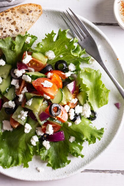 Plate with greek salad for dinner