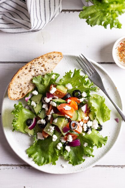 Plate with greek salad for dinner