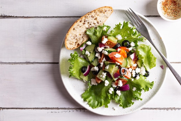 Plate with greek salad for dinner