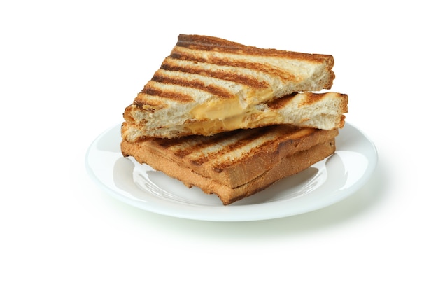 Plate with grilled sandwiches isolated on white background