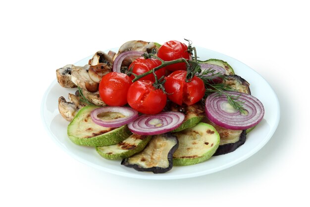 Plate with grilled vegetables isolated on white background