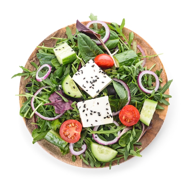 Plate with healthy salad on white background